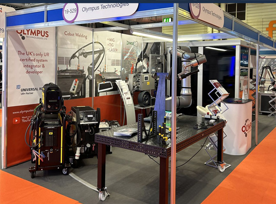 Olympus Technologies stand at MACH 2024, showcasing the latest developments in cobot welding, cobot, press brake tending and cobot machine tending.