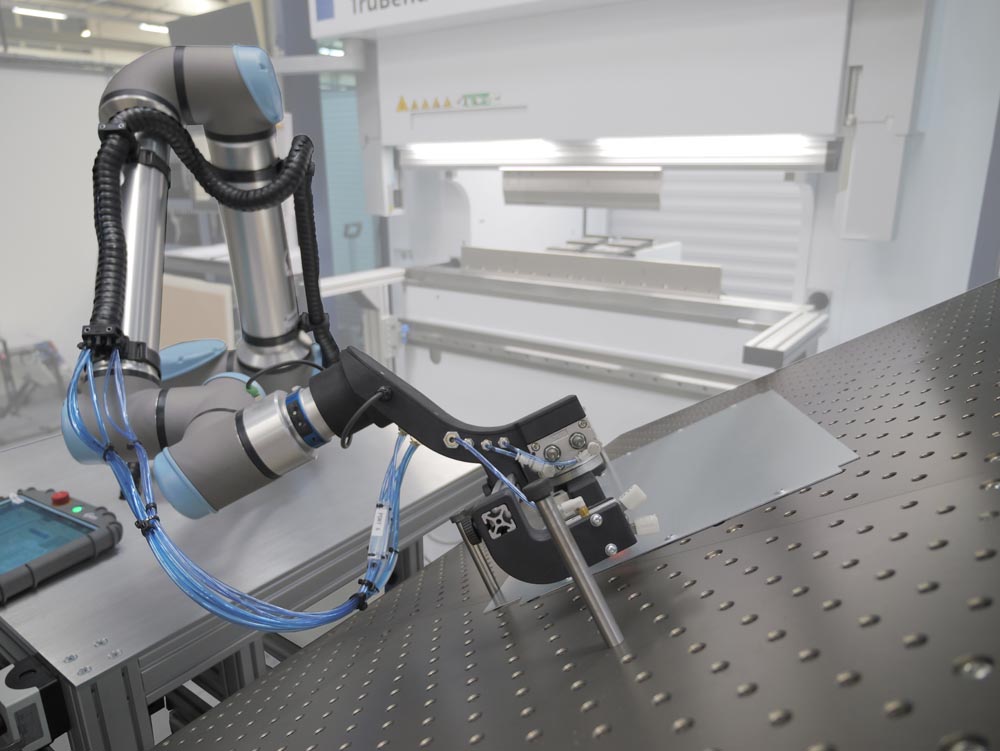 Olympus Technologies has developed a standard cobot press brake tending solution, which enables a batch of parts to be manufactured through your press brake without human interaction.